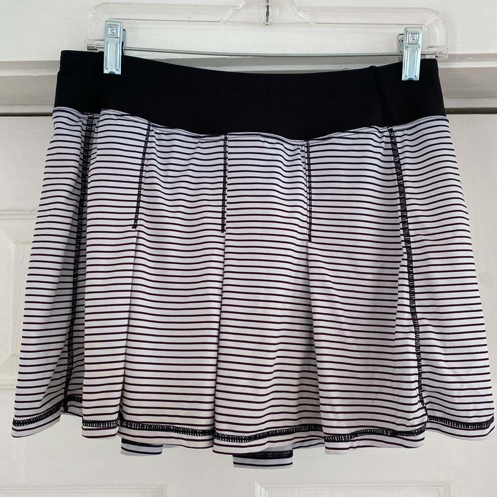 Black and white striped tennis skirt with zip pocket in back and built in shorts